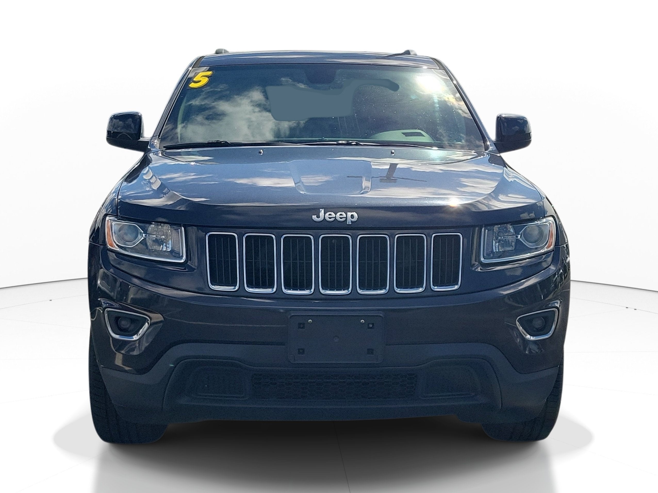 Used 2015 Jeep Grand Cherokee Laredo E with VIN 1C4RJFAG7FC212128 for sale in Sarasota, FL